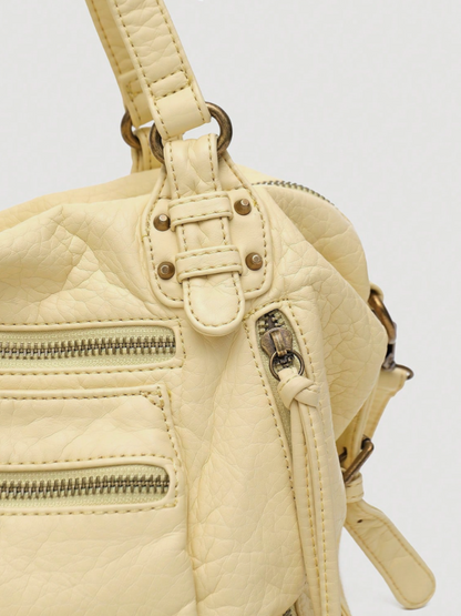 [strip: 100% Vegan Leather | The vegan leather feels pleasantly soft while being water-resistant, scratch-proof, and exceptionally durable. This way, the bag retains its elegant look even with daily use.]