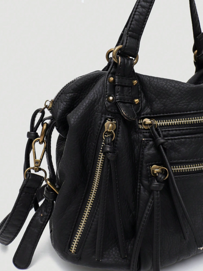 [strip: 100% Vegan Leather | The vegan leather feels pleasantly soft while being water-resistant, scratch-proof, and exceptionally durable. This way, the bag retains its elegant look even with daily use.]