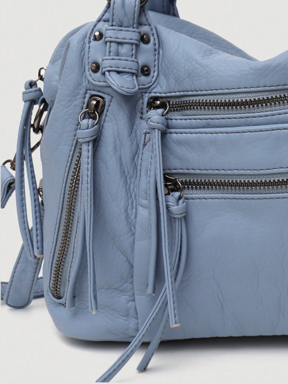 [strip: 100% Vegan Leather | The vegan leather feels pleasantly soft while being water-resistant, scratch-proof, and exceptionally durable. This way, the bag retains its elegant look even with daily use.]