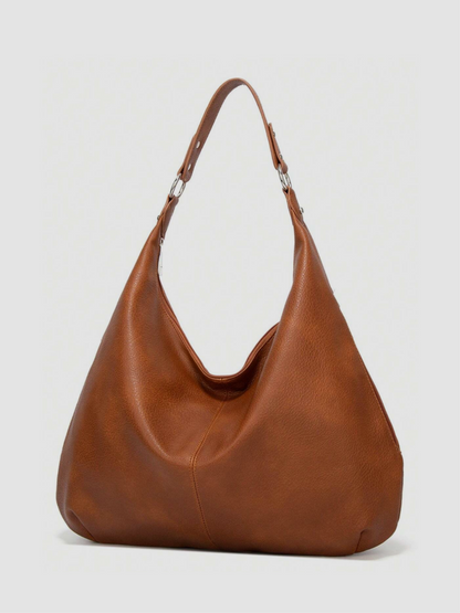 [strip: Wide Shoulder Straps | The straps are just the right length so you can comfortably carry the bag over your shoulder. Especially comfortable thanks to their wide cut, so nothing digs in or hangs awkwardly, even on longer days.]