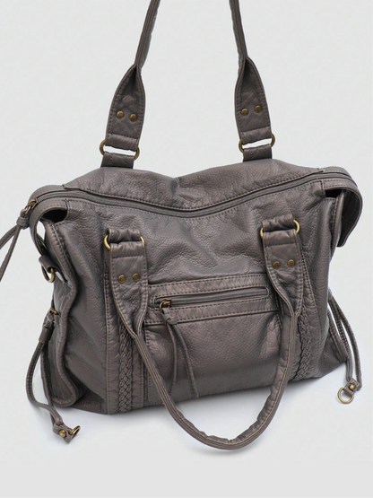 [strip: 100% veganes Leder | Das vegane Leder fühlt sich angenehm weich an und ist gleichzeitig wasserabweisend, kratzfest und besonders robust. So behält die Tasche auch bei täglicher Nutzung ihre elegante Optik.]