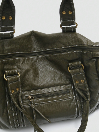 [strip: 100% veganes Leder | Das vegane Leder fühlt sich angenehm weich an und ist gleichzeitig wasserabweisend, kratzfest und besonders robust. So behält die Tasche auch bei täglicher Nutzung ihre elegante Optik.]